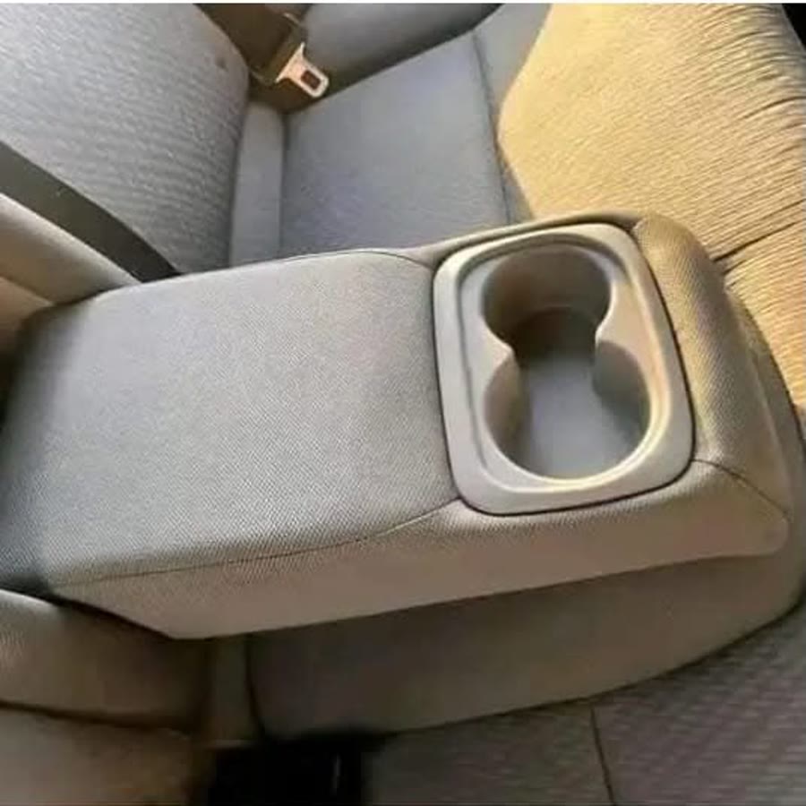 Clean rear-seat armrest after interior detailing
